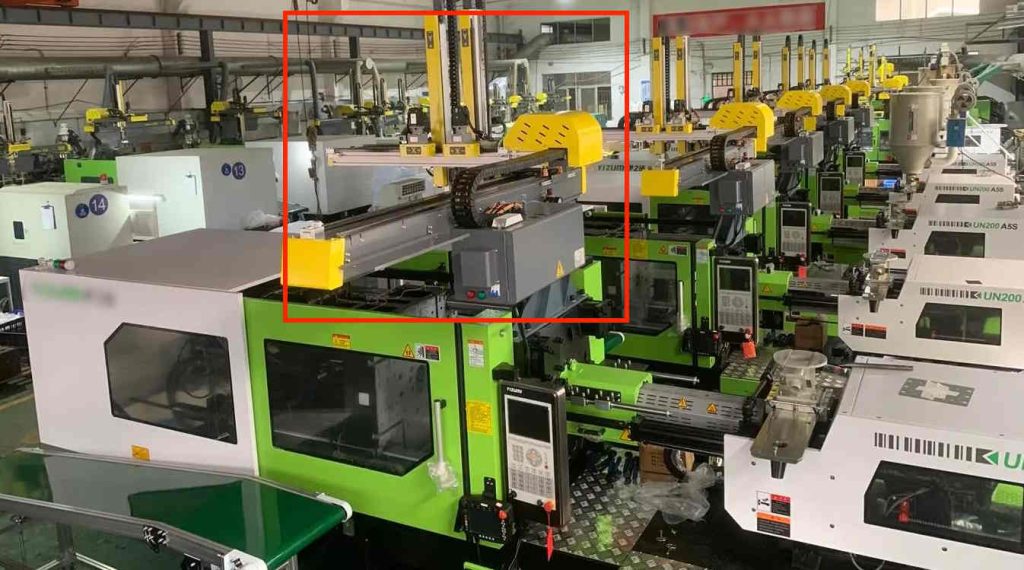 injection molding machine with robot ejection system